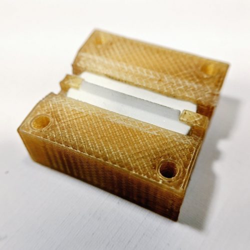 AIS-ILIS1 Ionic Liquid Electrospray Enhanced 3D Printed Ultem Housing with Porous Glass Emitter